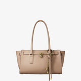 Beige tote bag with gold hardware and tassel charm